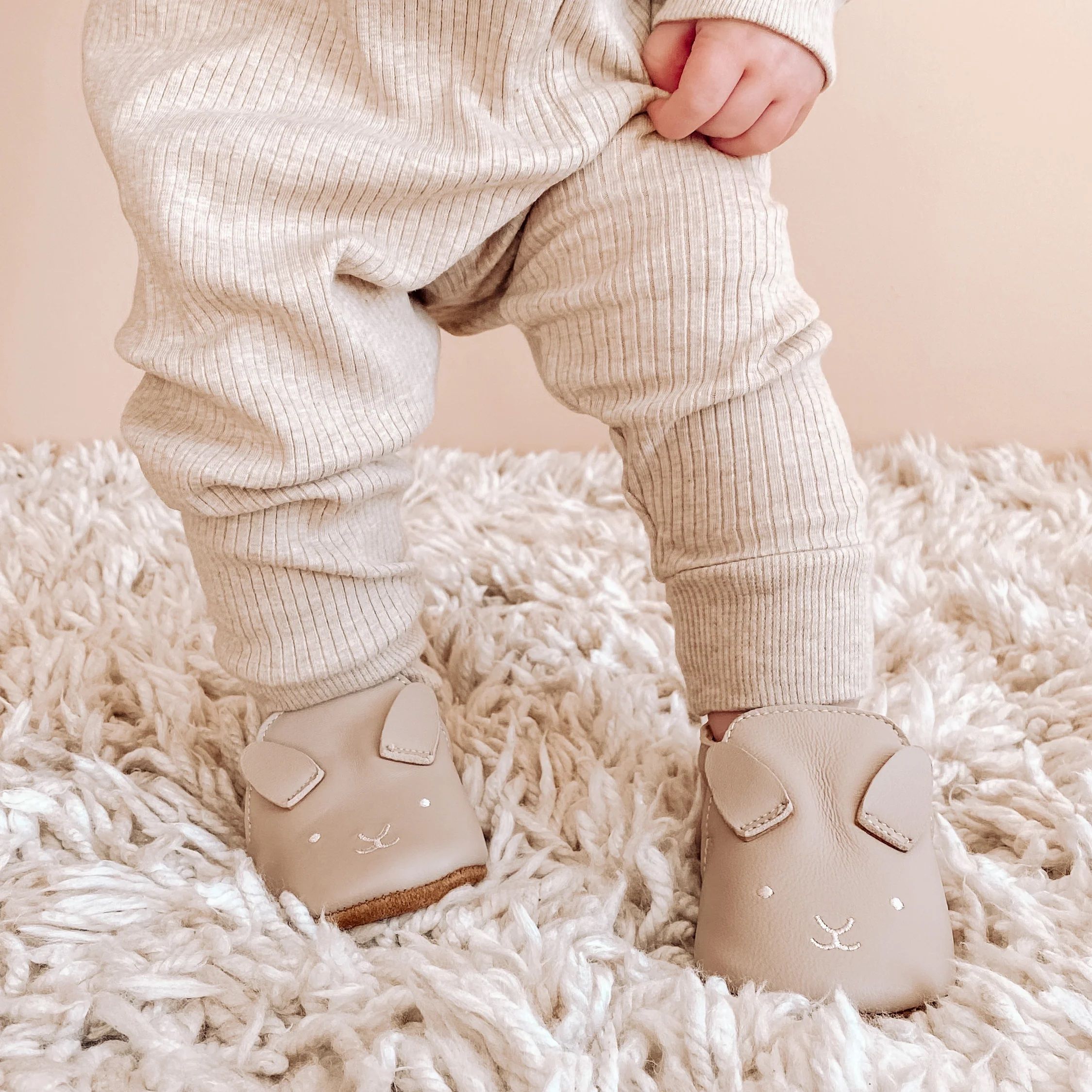 Baby standing in shoes