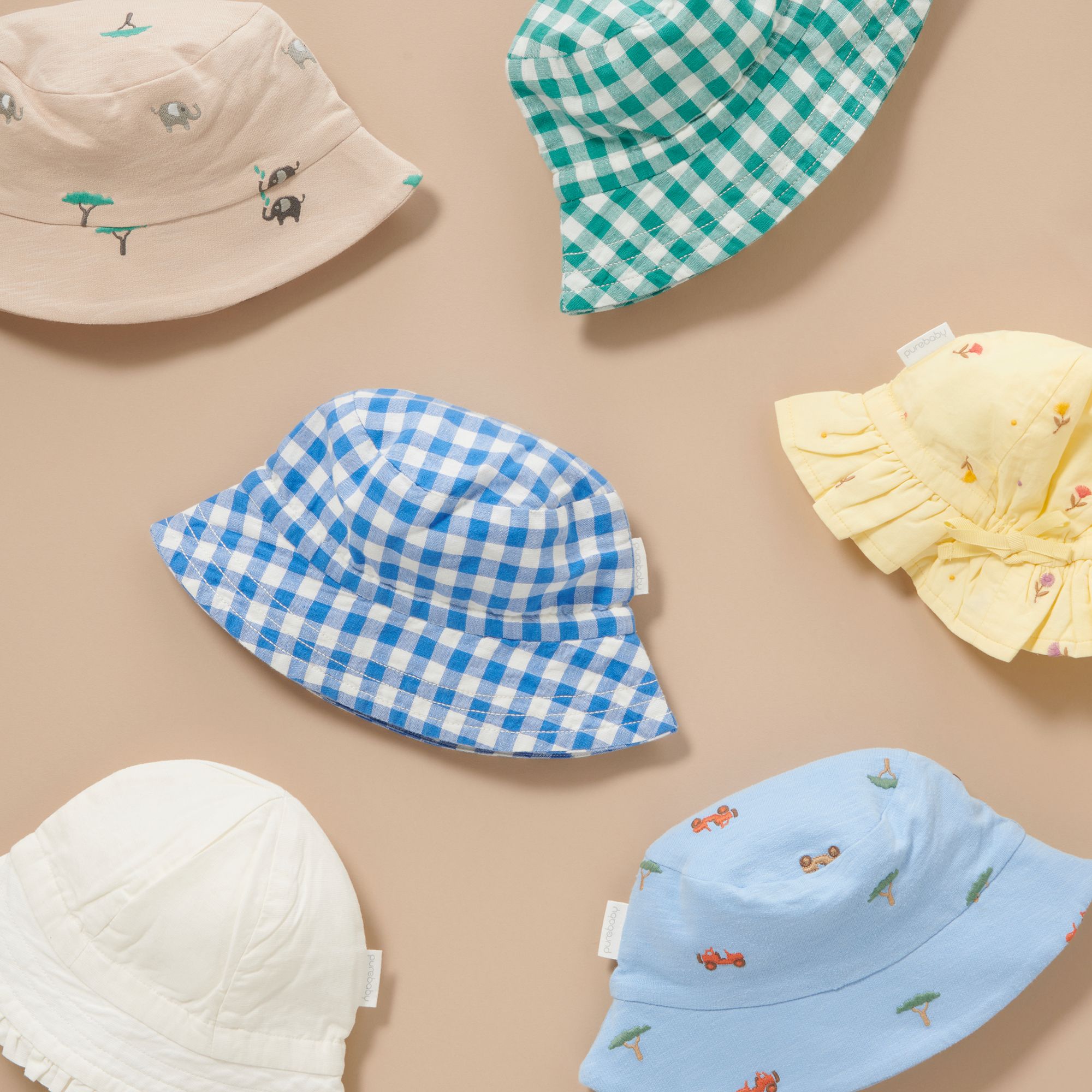 Sun hats laying on brown paper
