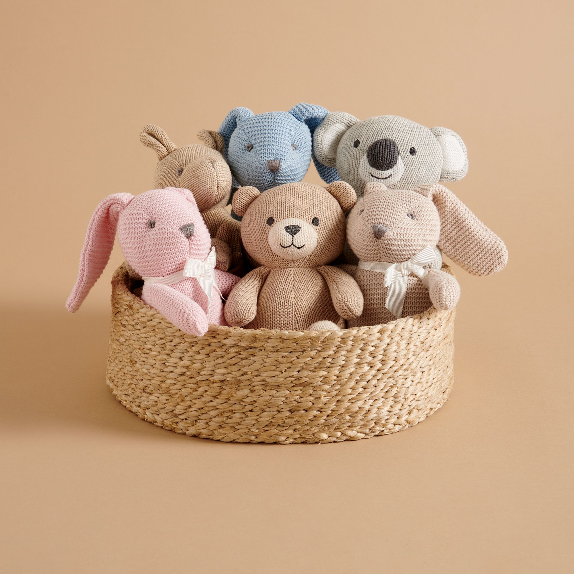 Basket of soft knitted toys