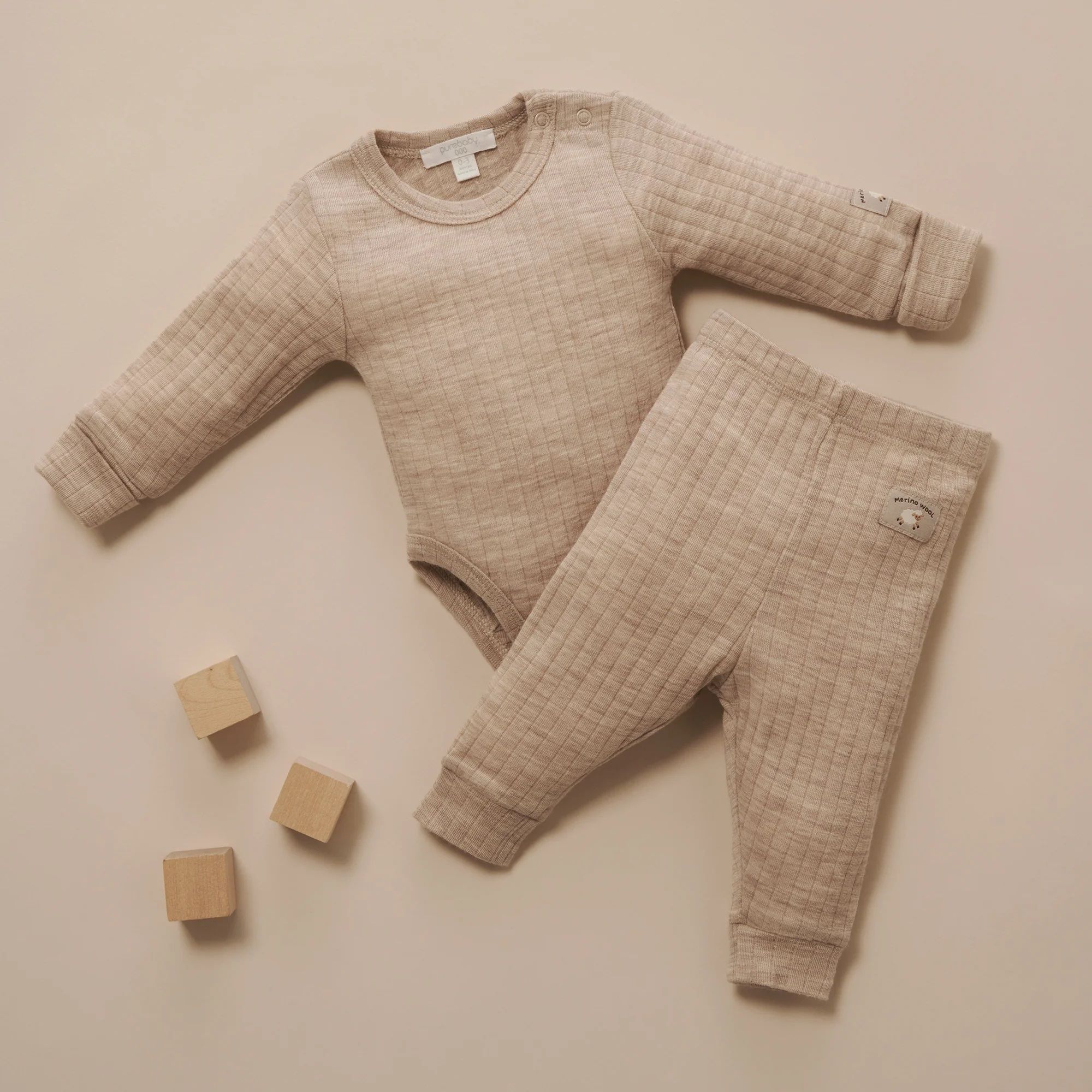 Merino wool bodysuit and Legging laying on ground